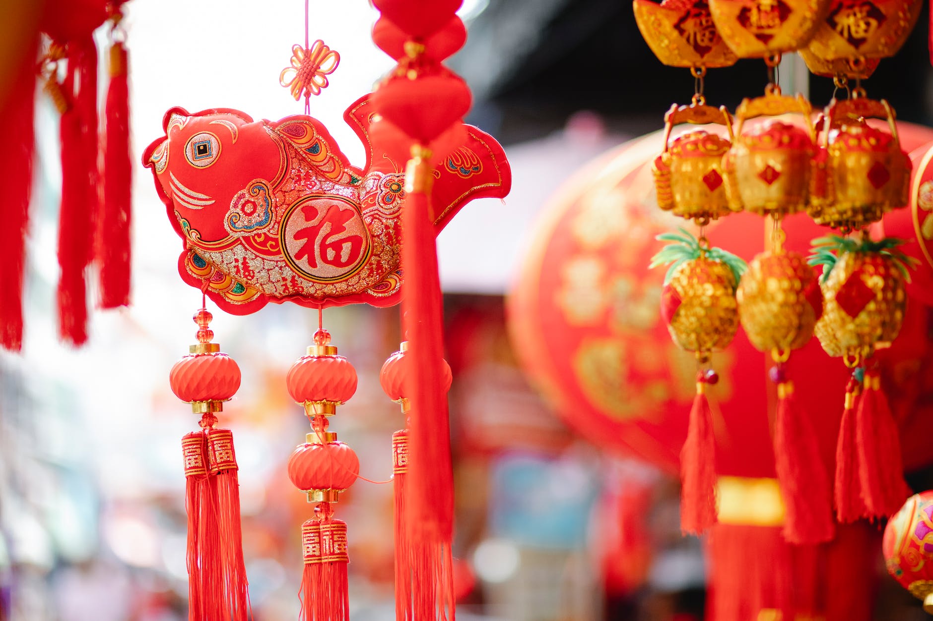 traditional oriental lanterns and decor hanging on street