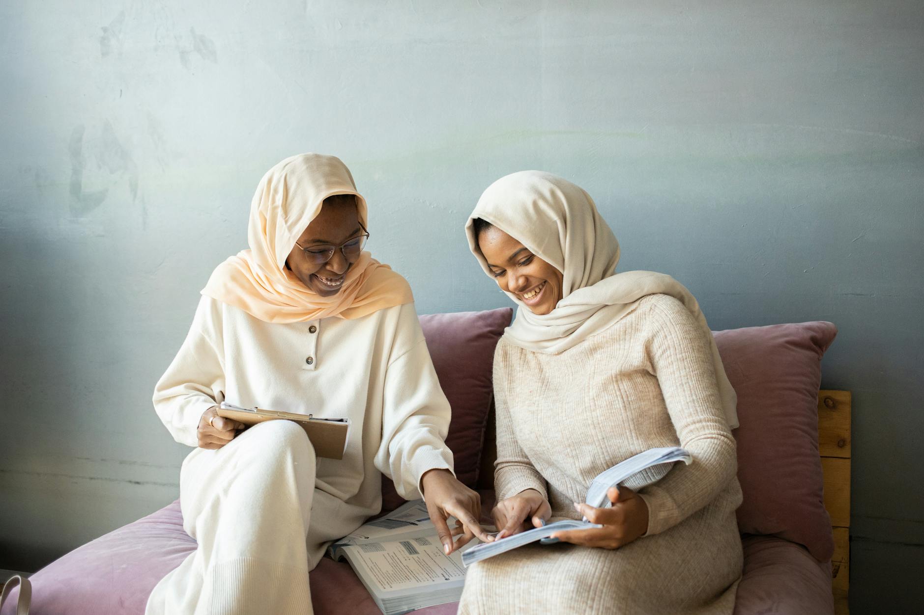 women sitting on the couch